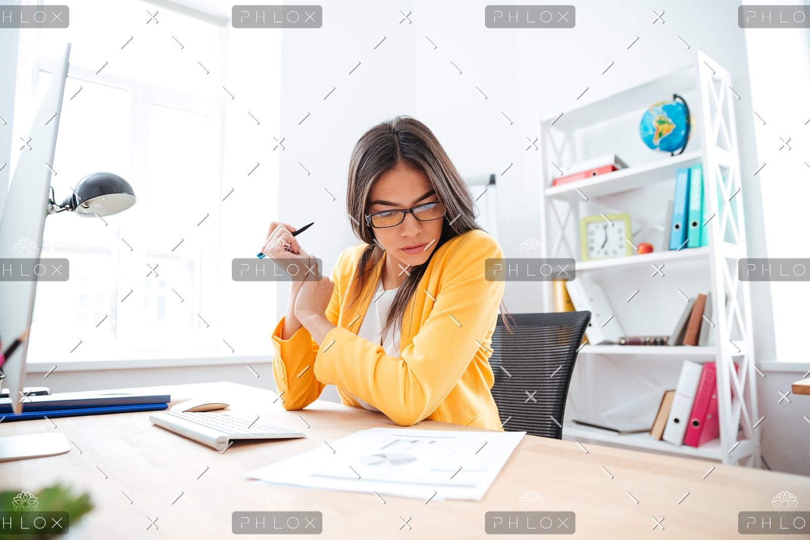 demo-attachment-449-businesswoman-analysing-document-P8WSNMC