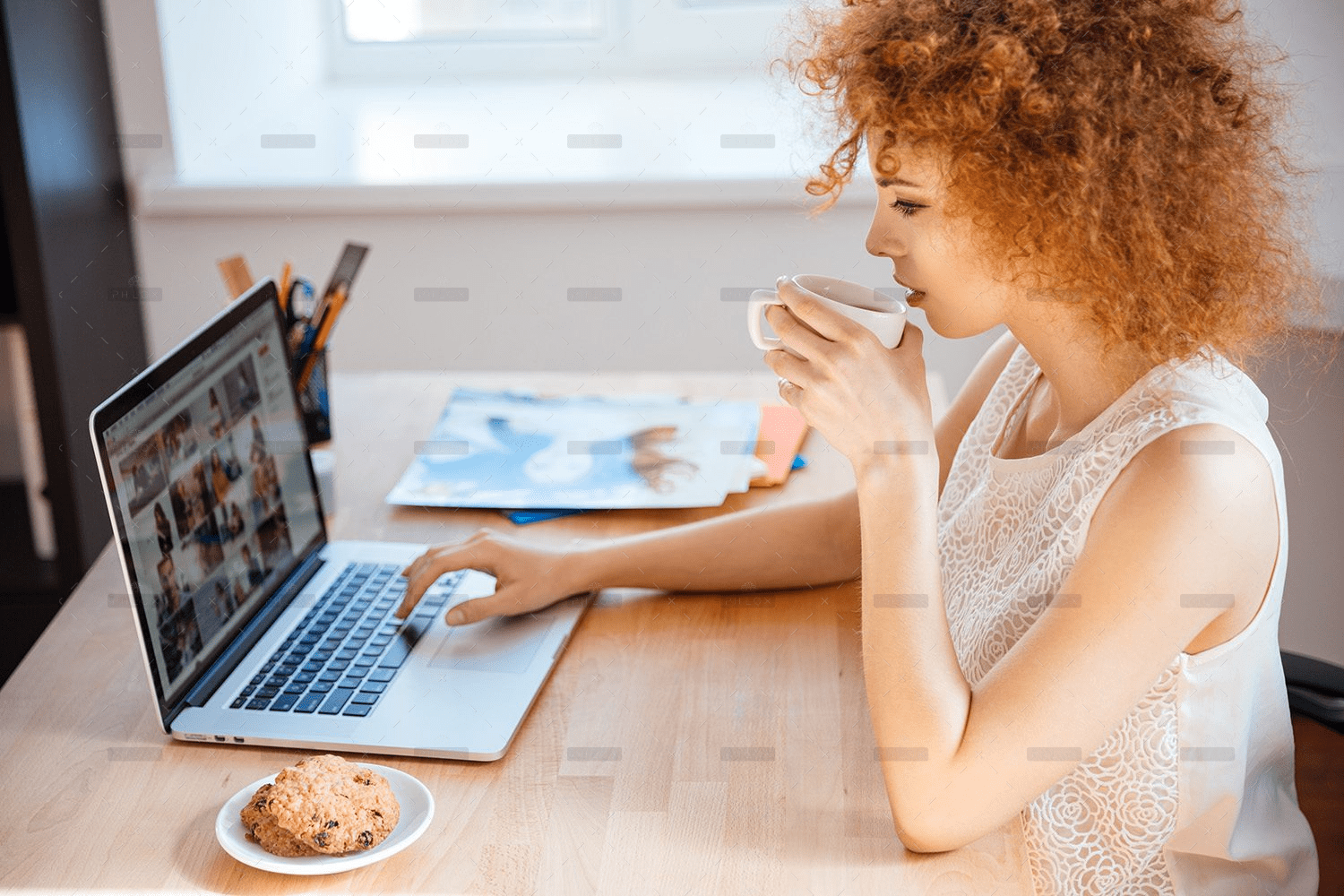 woman-photographer-drinking-coffee-and-working-PJNBP6U.png